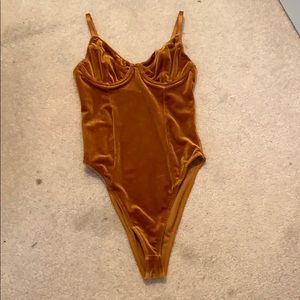 Orange velour body suit